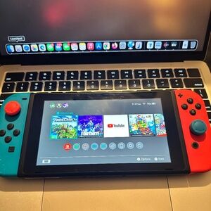 Nintendo Switch with Neon Blue and Neon Red Joy-Con